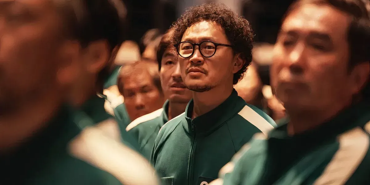 Yong-sik standing in a crowd of players in Squid Game season 2