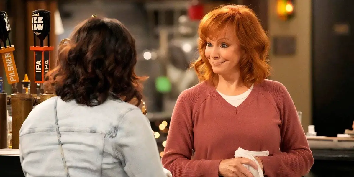 Reba McEntire smiles at Isabella in Happy's Place