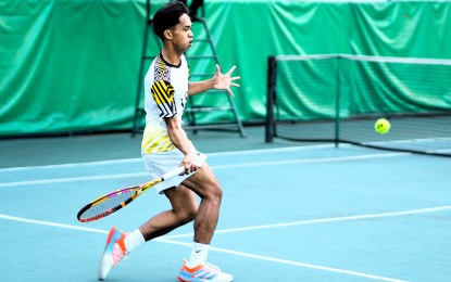 <p><strong>WINNER. </strong>University of Santo Tomas player EJ Tangub makes a forehand return to Ateneo's Austin delos Santos during the UAAP Season 86 men's tennis tournament at the Felicisimo Ampon Tennis Center inside the Rizal Memorial Sports Complex in Manila on March 13, 2024. Tagub won, 6-2, 6-1. <em>(UAAP photo) </em></p>