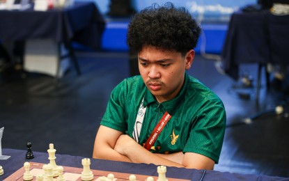 <p><strong>SWEEP.</strong> FIDE Master Mark Bacojo of Far Eastern University competes in the UAAP Season rapid chess tournament at the Adamson gym in this undated photo. He garnered 4.5 points in five rounds as the Tamaraws swept the elimination round with five consecutive wins.<em> (UAAP photo)</em></p>