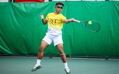 <p><strong>TOP SEED.</strong> UST's Nilo Ledama makes a forehand return during the UAAP Season 87 tennis tournament at the Felicisimo Ampon Tennis Center in Manila on March 23, 2025. UST is eyeing a third straight title. <em>(UAAP photo)</em></p>