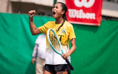<p><strong>FINALS MVP.</strong> University of Santo Tomas' Mica Emana reacts after winning a point against National University's Danna Abad in the UAAP Season 87 women's tennis final at Felicisimo Ampon Tennis Center in Manila on Sunday (April 13, 2025). Emana won, 7-5, 4-6, 6-2, to seal the title for UST. (<em>UAAP photo)</em></p>