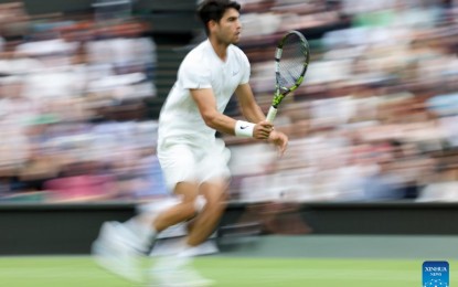 <p><strong>QUARTERFINALIST</strong>. Carlos Alcaraz competes during the men's singles 4th round match between Ugo Humbert of France and Carlos Alcaraz of Spain at Wimbledon tennis Championship in London, Britain, on Sunday (July 7, 2024). Alcaraz defeated Humbert, 6-3, 6-4, 1-6, 7-5, to advance to the quarterfinals.<em> (Xinhua/Han Yan)</em></p>