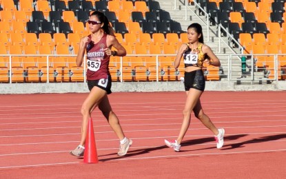 <p><strong>THREE-TIME CHAMPION.</strong> University of the Philippines student Julianna Talaro breaks away from University of Santo Tomas' Azeneth Serat during the ICTSI Philippine Athletics Championships women's 10,000-meter walk race at the New Clark City Athletic Stadium in Capas, Tarlac on Thursday (May 1, 2025). Talaro clocked 55 minutes and 57.21 seconds to claim her third straight title. <em>(Contributed photo) </em></p>