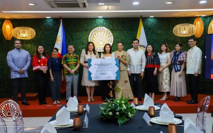<p><strong>MUSLIM-FRIENDLY.</strong> MHR managing director Cleofe Albiso (5th from left) receives the MFAE certification from Tourism Secretary Christina Frasco on Wednesday (Dec. 18, 2024) at the DOT headquarters in Makati City. All 13 properties of Megaworld Hotels & Resorts have been named 100 percent Muslim-friendly by the Department of Tourism, making it the first hospitality chain in the country to get all its accommodation establishments certified. <em>(Photo courtesy of DOT)</em></p>