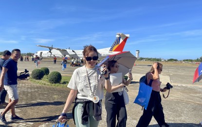 <p><strong>TOURIST ARRIVALS.</strong> Tourists arrive at the Laoag International Airport in this undated photo. Providing incentives such as value-added tax refunds to foreign travelers would make the Philippines “competitive” as a destination among its peers in Southeast Asia, the Department of Tourism said Thursday (Sept. 26, 2024). <em>(PNA file photo by Leilanie Adriano)</em></p>