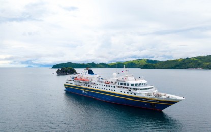 <p><strong>PICTURESQUE</strong>. The cruise ship Heritage Adventurer spotted near Daram Island in Samar on Monday (June 16, 2025). The Department of Tourism has welcomed the first visit of a cruise ship in Samar as it puts the province on the country’s cruise expedition map. <em>(Photo courtesy of Samar Provincial Tourism Office)</em></p>