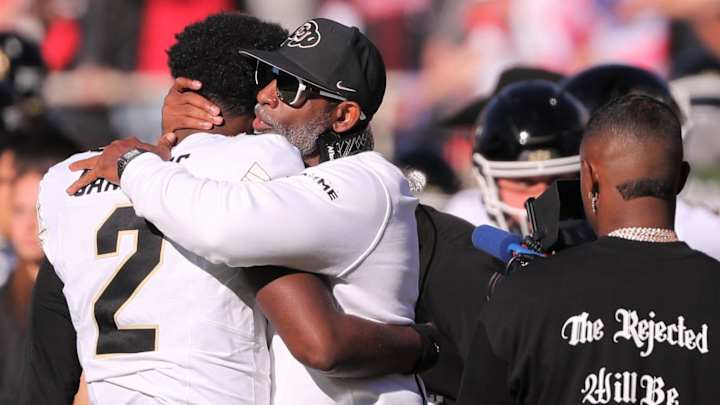 Colorado football coach Deion Sanders hugs his son, Shedeur Sanders, before facing Texas Tech. Colorado football coach Deion Sanders hugs his son, Shedeur Sanders, before facing Texas Tech.