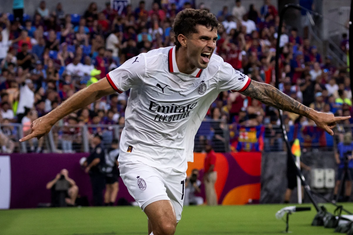 Christian Pulisic of Serie A side AC Milan celebrates after scoring a goal during the pre-season club friendly football match between Barcelona and AC Milan at M&T Bank Stadium in Baltimore, Maryland, August 6, 2024. (Photo by SAMUEL CORUM / AFP) (Photo by SAMUEL CORUM/AFP via Getty Images)