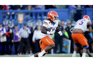 Ashton Jeanty is running away from Travis Hunter with the Heisman in hand