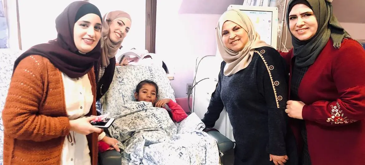 Shahd, 11, with her Determination School teachers in Augusta Victoria hospital, Palestine. Shahd, 11, with her Determination School teachers in Augusta Victoria hospital, Palestine.
