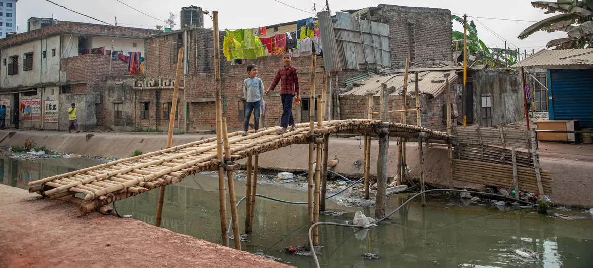 A polluted canal flows through a slum on the outskirts of Dhaka, the capital of Bangladesh.