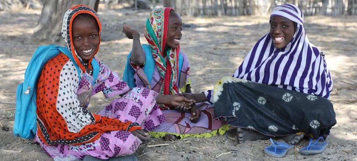 Hadjé, Achta and Ngoleram sit under a tree in Chad, enjoying the shade and the fresh air from the lake. Hadjé, Achta and Ngoleram sit under a tree in Chad, enjoying the shade and the fresh air from the lake.