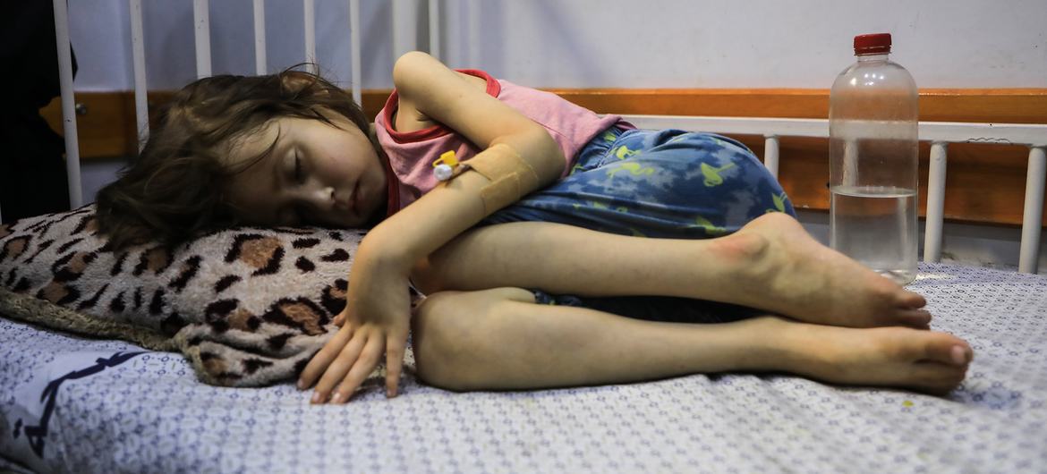A child suffering from malnutrition lies on a bed in the Patient Society Hospital in Gaza City. A child suffering from malnutrition lies on a bed in the Patient Society Hospital in Gaza City.