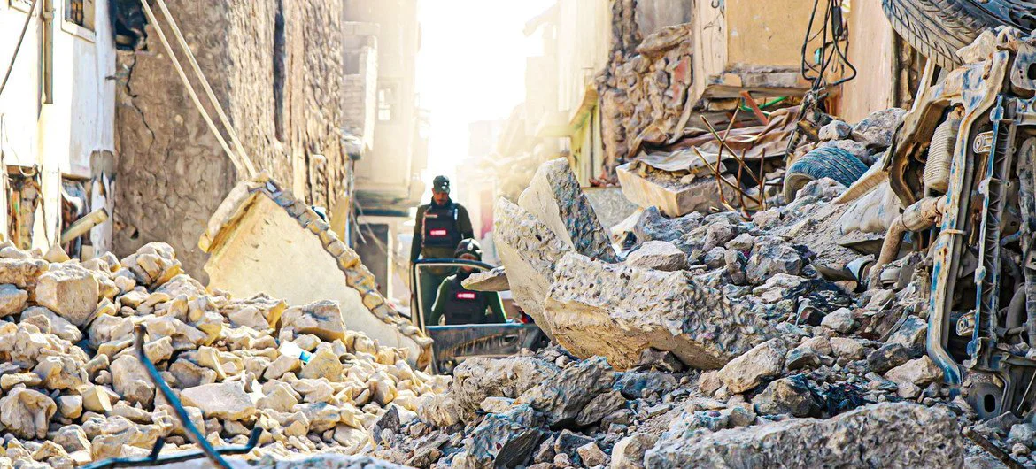 An UNMAS team in war-torn Mosul, Iraq, searches for and clears explosives in the rubble.