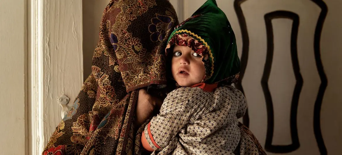 A mother and her child inside a medical clinic in Kandahar, Afghanistan.