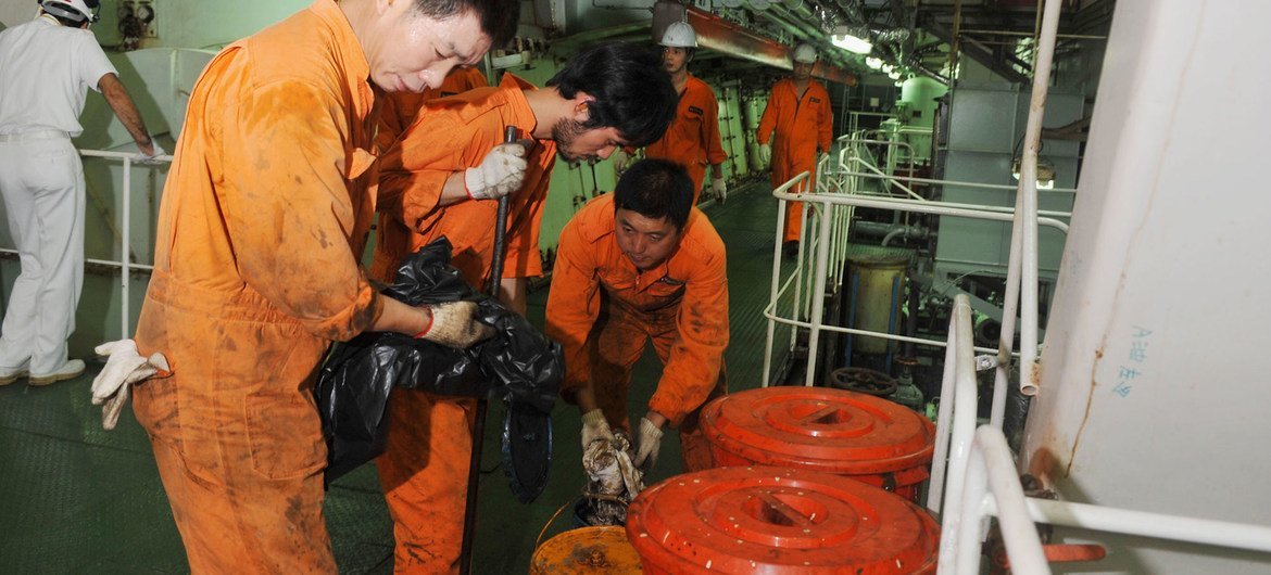 Seafarers work in the engine room of a Chinese registered ship in the Port of Genoa in Italy. (file) Seafarers work in the engine room of a Chinese registered ship in the Port of Genoa in Italy. (file)