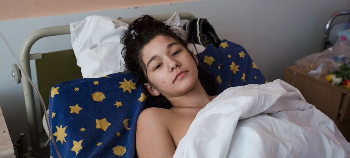 An injured girl rests in a medical ward in Kyiv, Ukraine, after her car was shelled. An injured girl rests in a medical ward in Kyiv, Ukraine, after her car was shelled.