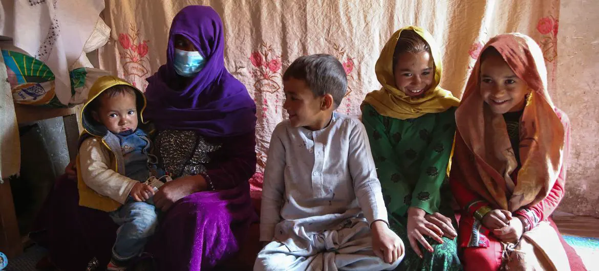 A family sit inside their home, in an informal settlement for internally displaced people in Kabul, Afghanistan. A family sit inside their home, in an informal settlement for internally displaced people in Kabul, Afghanistan.