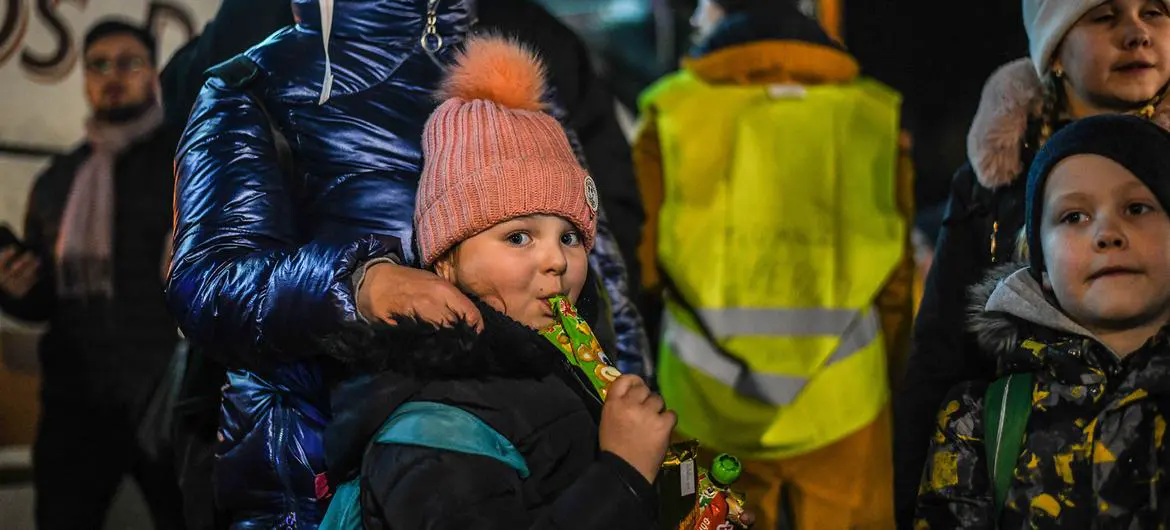 Refugees from Ukraine wait for a bus to continue their journey after crossing the Polish border to Medyka. Refugees from Ukraine wait for a bus to continue their journey after crossing the Polish border to Medyka.