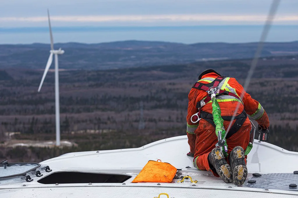 A technician works on a wind turbine blade in eastern Quebec, Canada. 