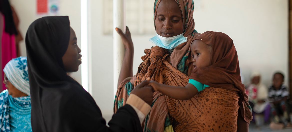 A girl plays with her younger sister at a maternal child health care centre in Hargeisa, Somaliland. A girl plays with her younger sister at a maternal child health care centre in Hargeisa, Somaliland.