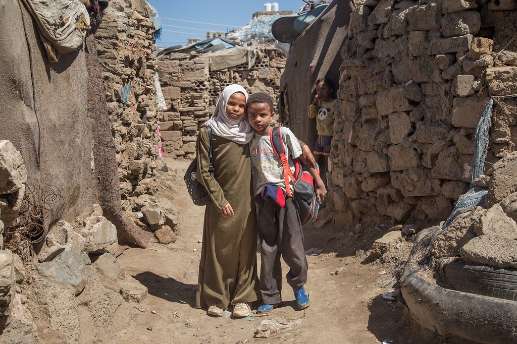 A twelve-year-old Yemeni girl and her younger brother who she tutors in mathematics. A twelve-year-old Yemeni girl and her younger brother who she tutors in mathematics.