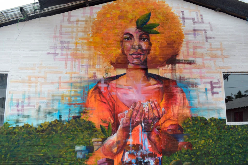 A mural in a rural area in Colombia shows the relationship between women and the environment. A mural in a rural area in Colombia shows the relationship between women and the environment.