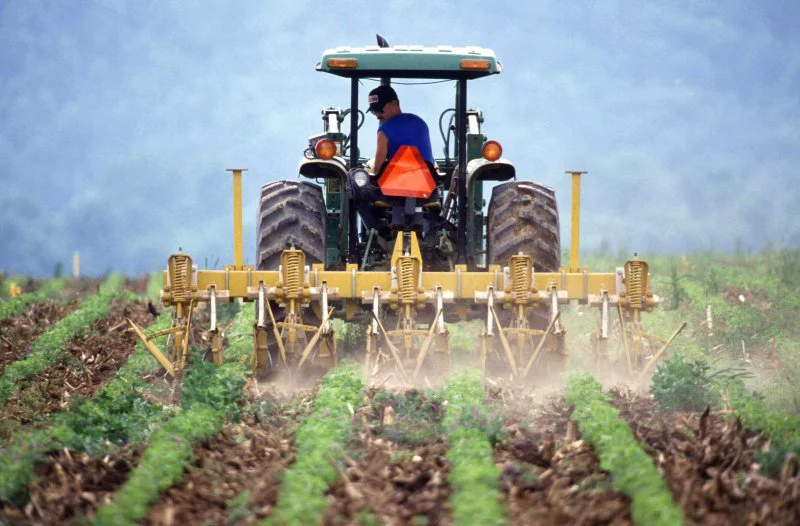 farmer and tractor tilling soil farmer and tractor tilling soil