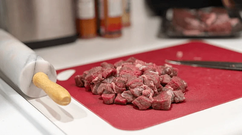 sliced raw meat on chopping board thumbnail sliced raw meat on chopping board thumbnail