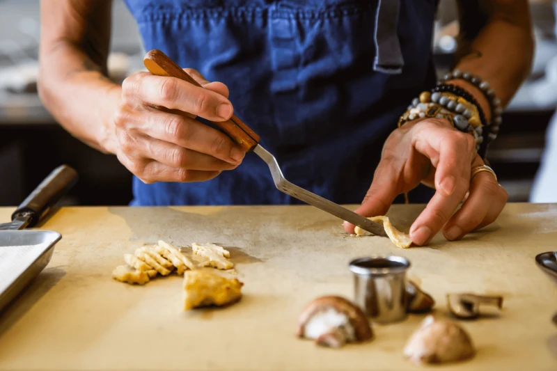 A chef prepares slices of a cultured meat. Credit: Upside Foods