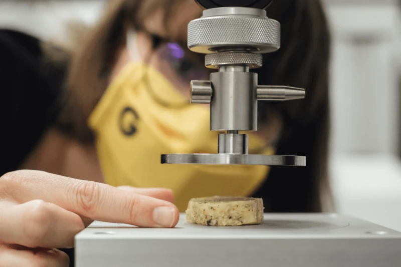 Marion Gaff, a food engineer at Gourmey, carries out density tests on lab-grown foie gras at the start-up’s laboratory in Paris, France. Credit: Bloomberg