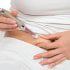 a woman administering a diabetes injections