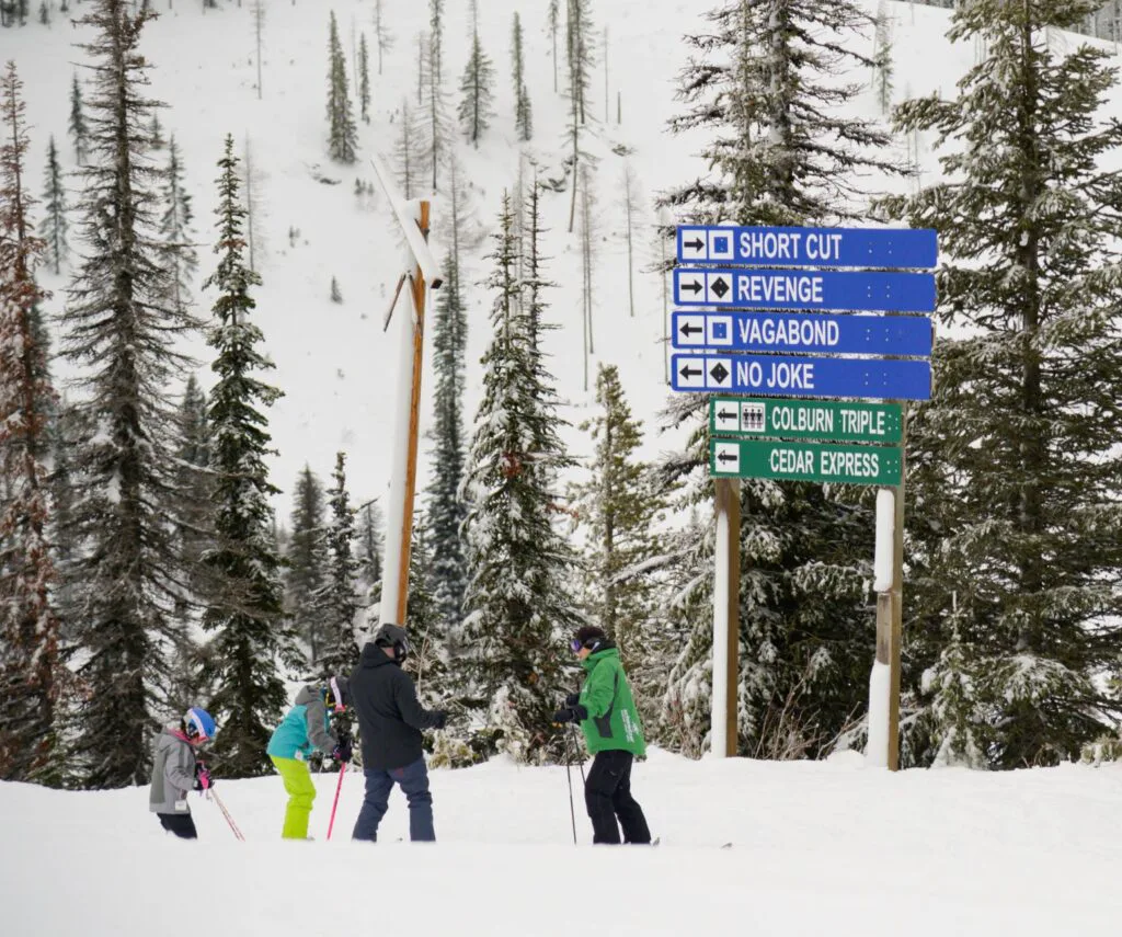 Family deciding what ski hill to go down at Schweitzer Mountain Resort.