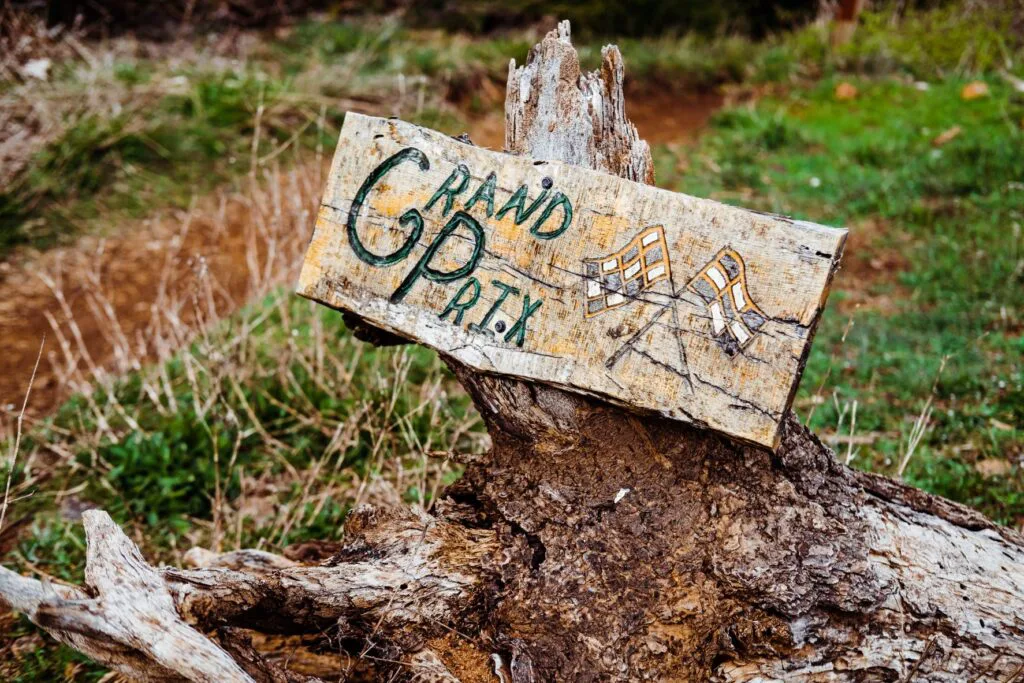 Trail signs on stumps remind riders that Post Canyon is a working timber farm. 