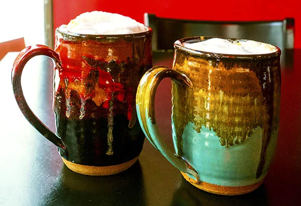 Photo of coffee in hand-painted mugs at the Wallace Coffee House at 6th & Cedar.