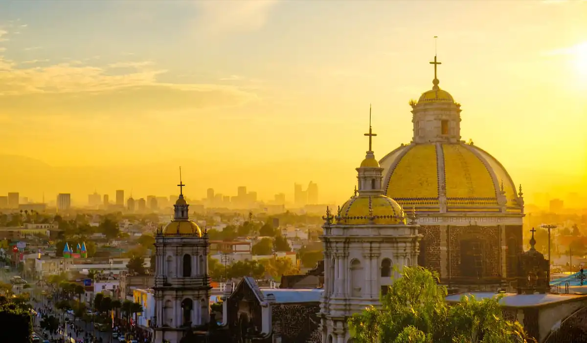A golden sky over the sprawling downtown Mexico City skyline in Mexico