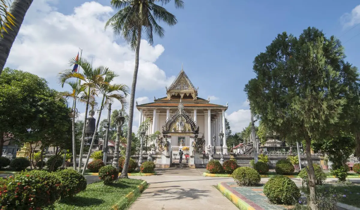 The Wat Bo Vil Temple surrounded by palm trees in Battambang, Cambodia