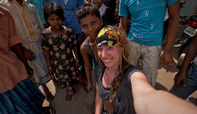 Candace Rardon in the middle of a photo taking session surrounded with local Indians