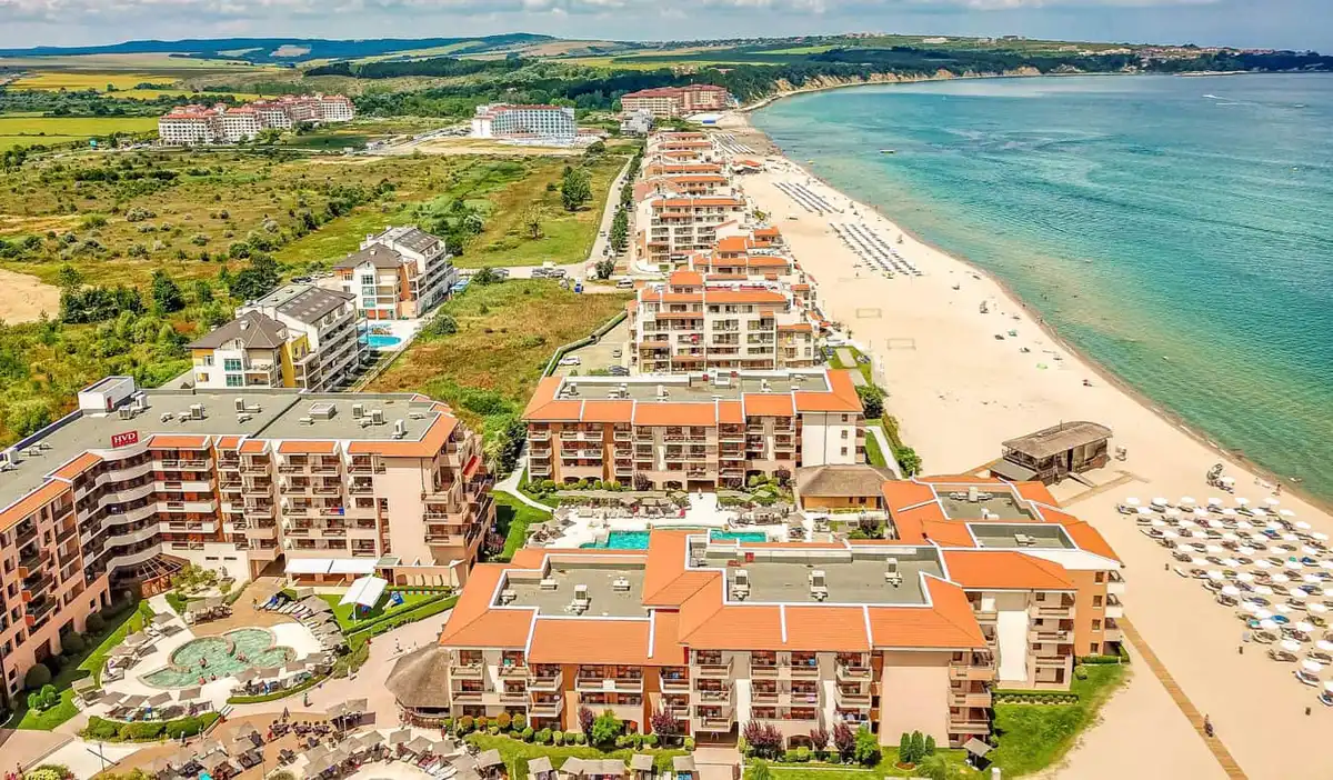 The crowded beach and waters of Sunny Beach in Bulgaria on a bright summer day