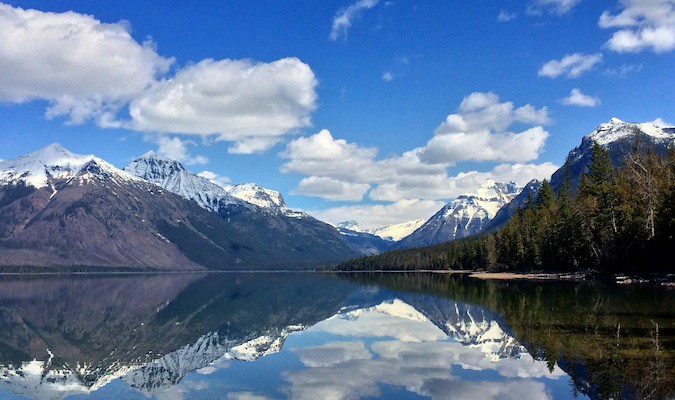 A massive snow-capped mountain in the distance at a national park in the USA