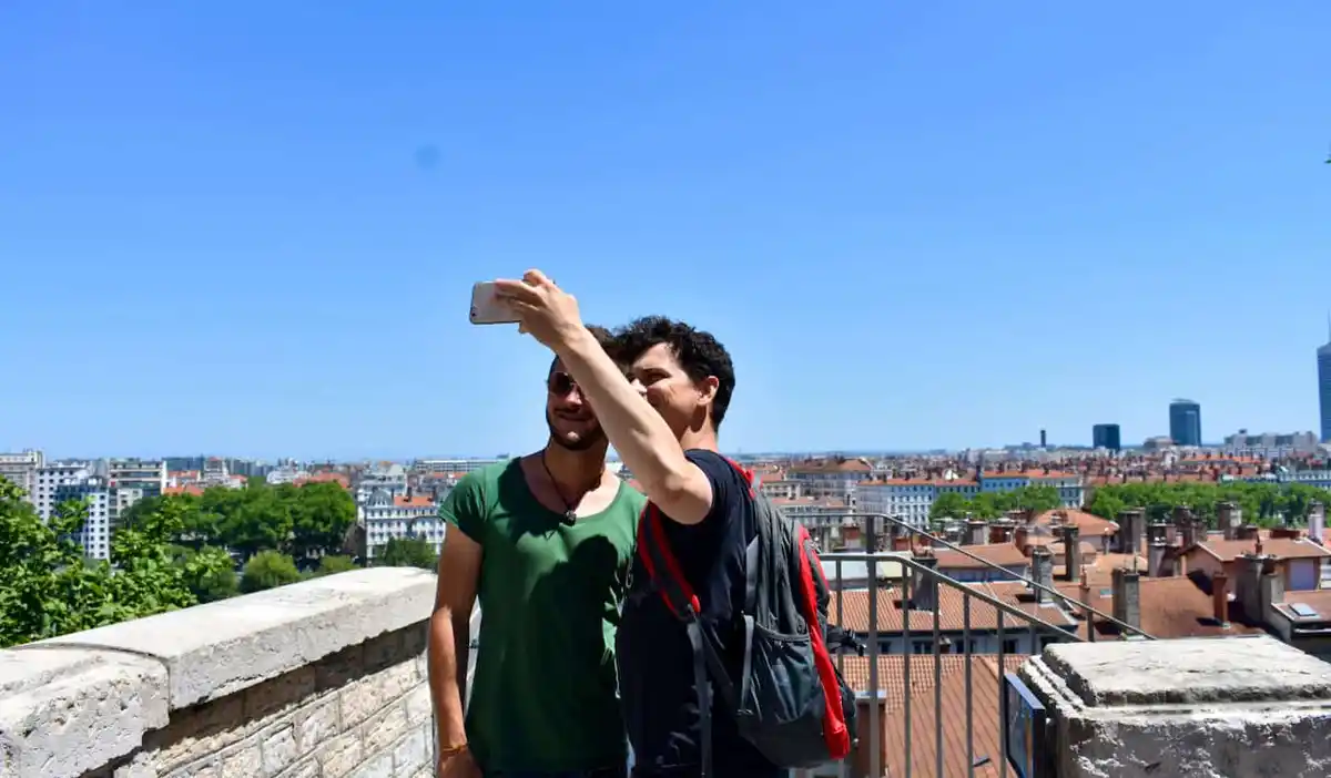 Nomadic Matt posing for a photo with his host in France