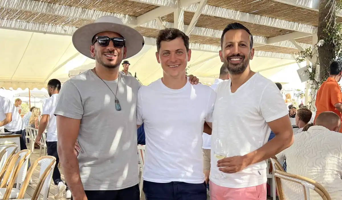 Nomadic Matt standing with two friends in St Tropez